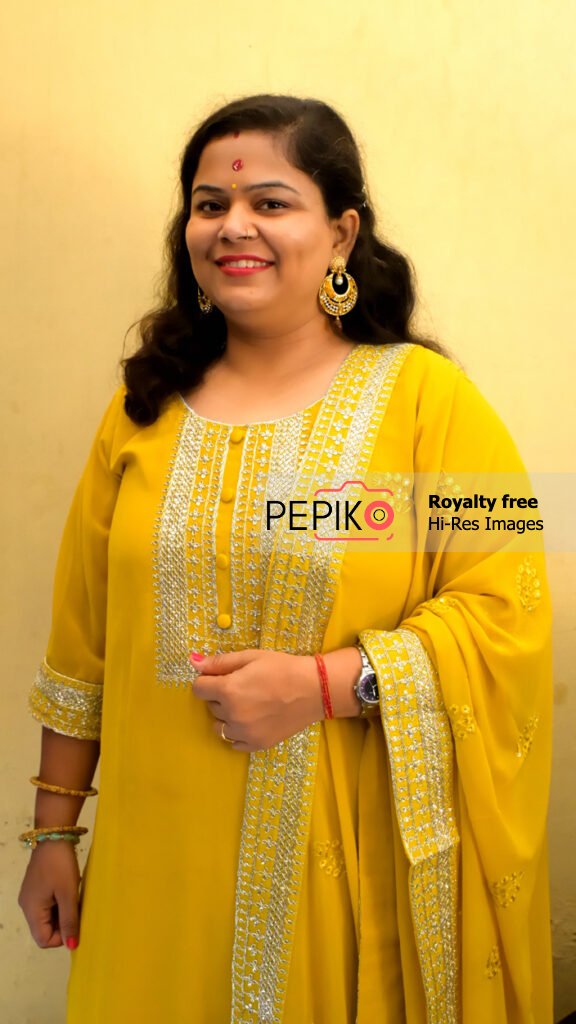 
									Model posing with yellow Indian culture wear