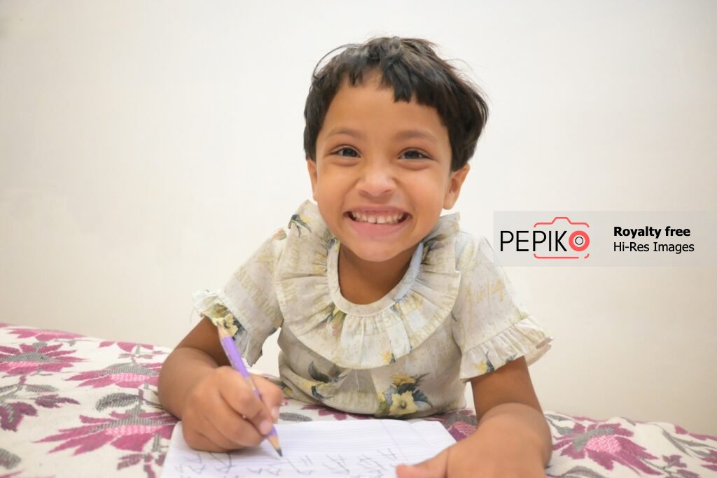 Young Student Completing Homework at Busy Tuition Center