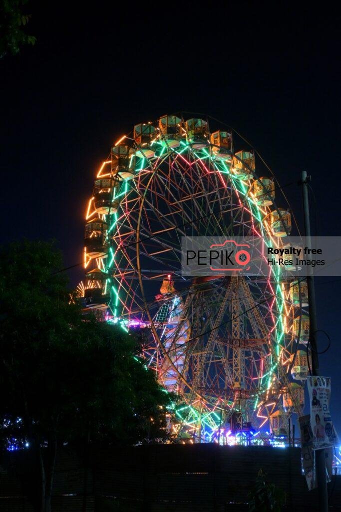 Enjoying Gaint Wheel Swings in Carnival.