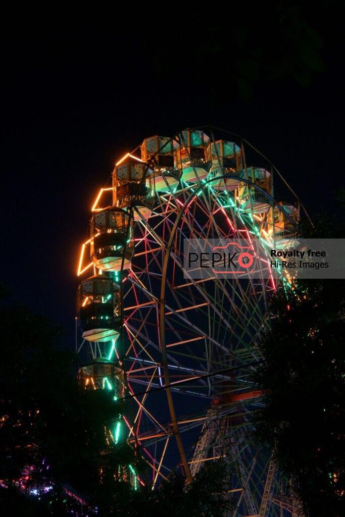 Enjoying Gaint Wheel Swings in Carnival.