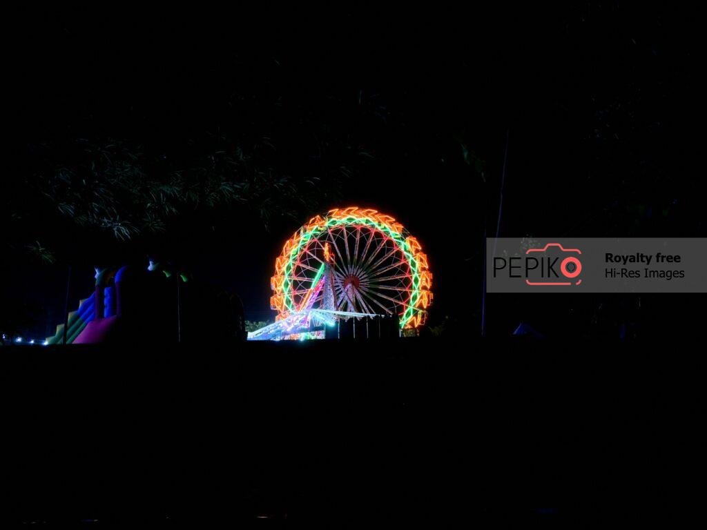 Enjoying Gaint Wheel Swings in Carnival.