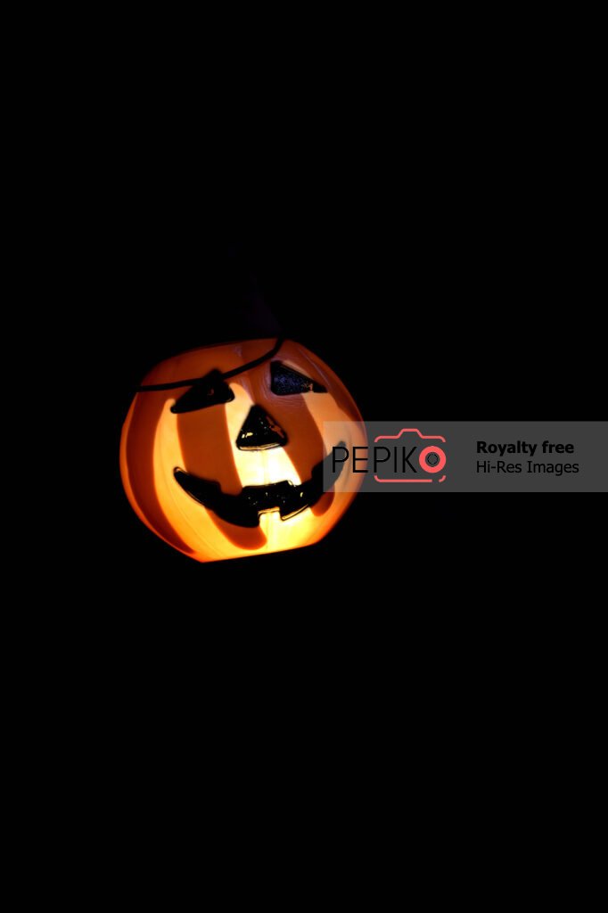 
									Orange pumpkin with cool stipes of light on Halloween theme.