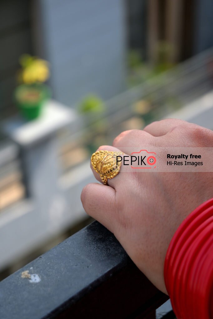 
									Another view of hand with vibrant red bangles