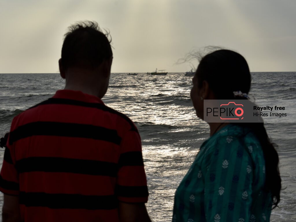 Mature husband and wife enjoying at beach