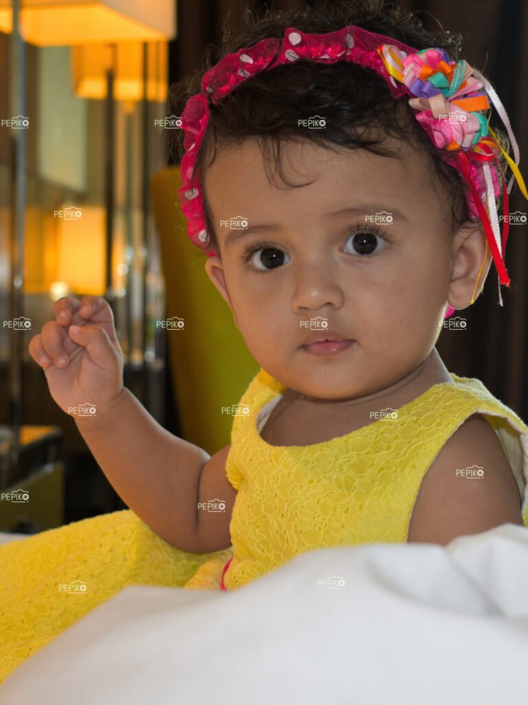 Picture of cute child in yellow dress
