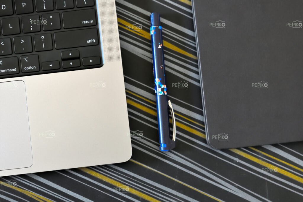 
									Picture of laptop pen and note book