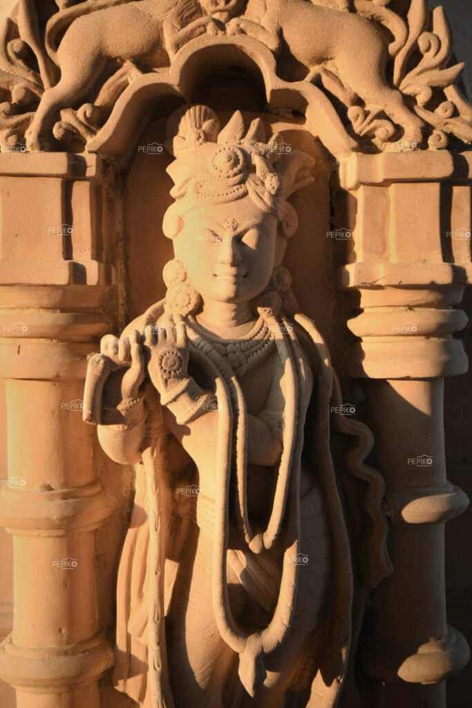 Amazing structure of Indian God Krishna on walls of temple