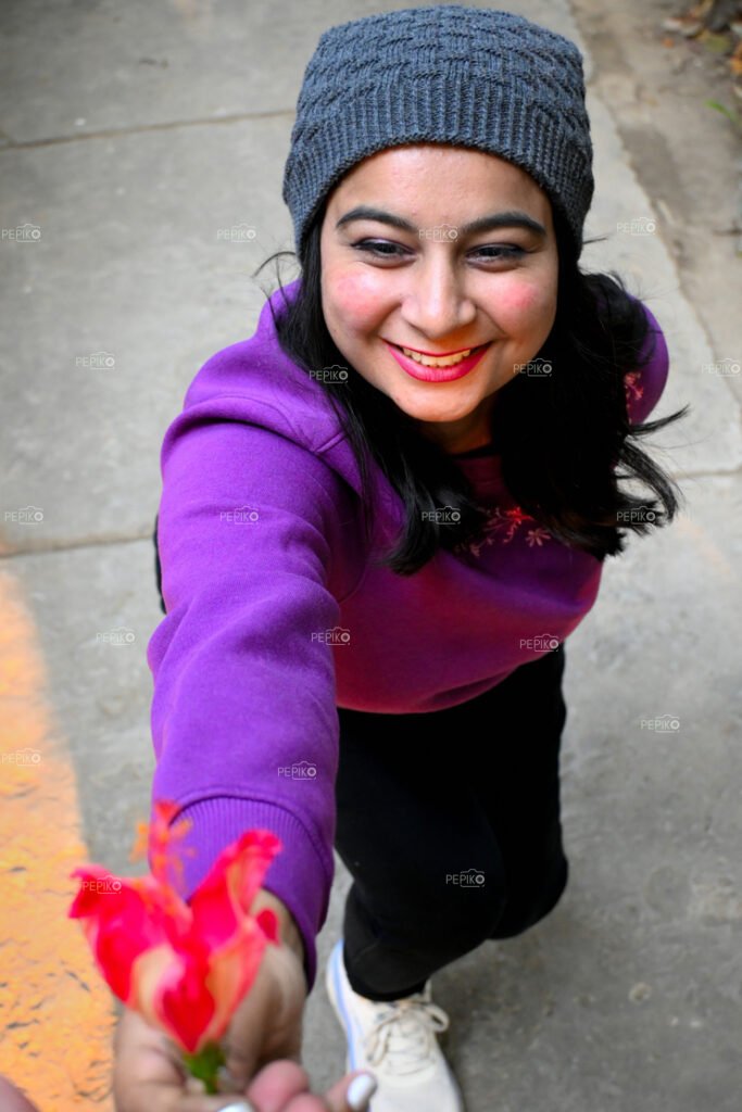 Charming girl giving flower