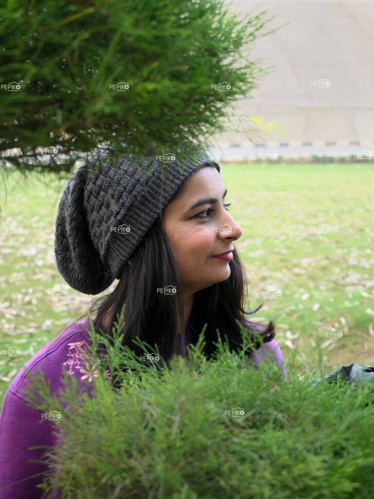 Side view of girl with winter cap / hat