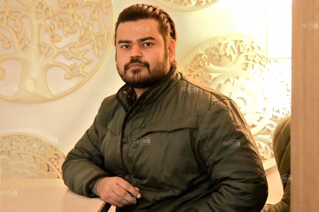 Picture of man in green jacket in winters