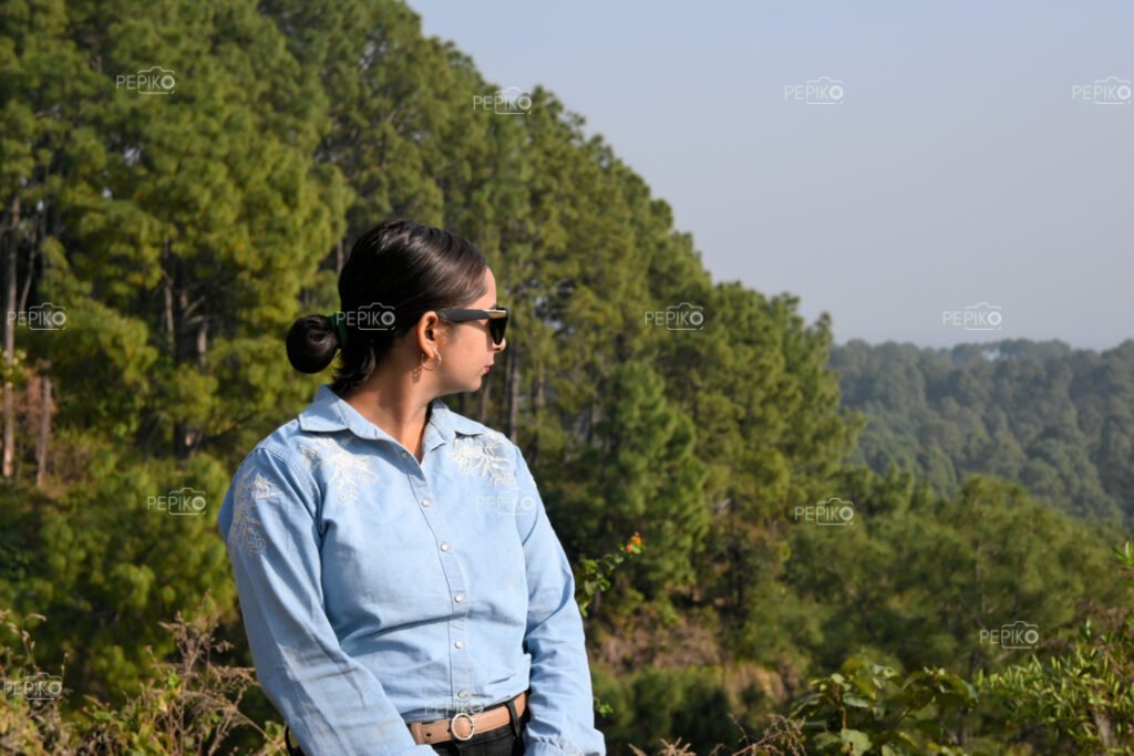 Side view of women posing in hills