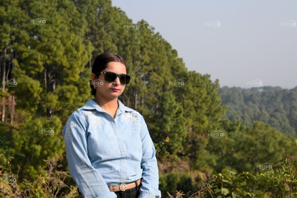 Portrait of a women with hills in background