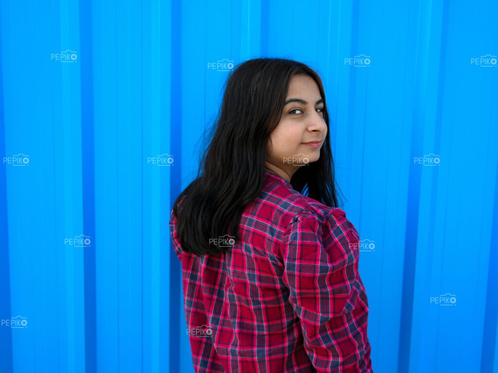 Closeup of Indian women with blue wall in background